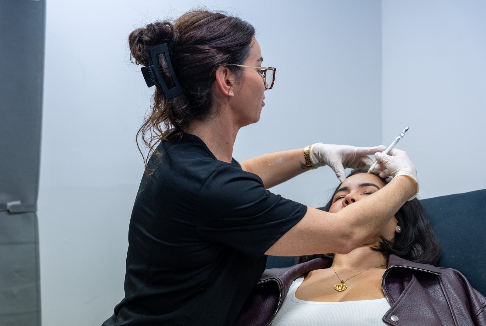 Healthcare professional performing a cosmetic injectable treatment